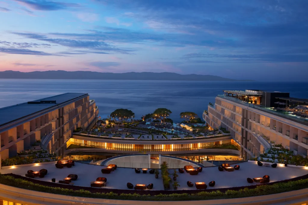 Panoramic dusk view of the Moon Deck overlooking the Pacific Ocean at Secrets Bahia Mita Surf & Spa Resort in Riviera Nayarit.