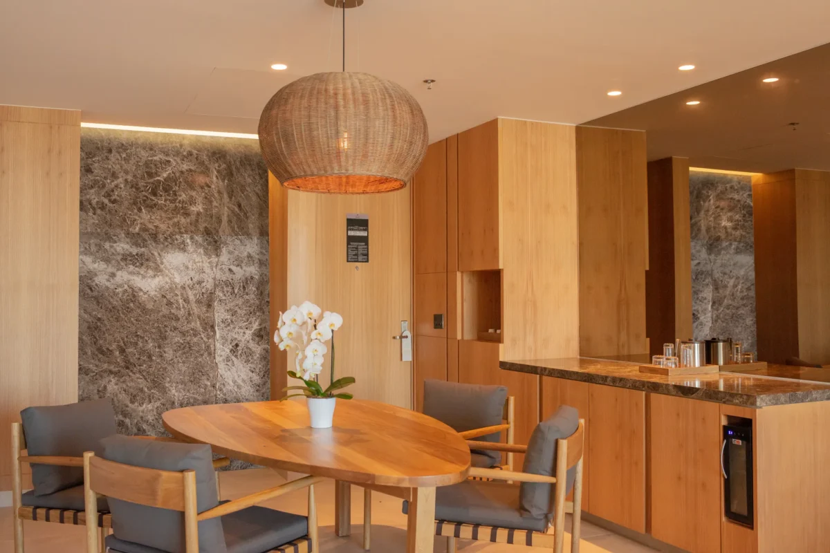 Preferred Club Ambition Suite Panoramic View living room with dining area at Secrets Bahia Mita Surf & Spa Resort.