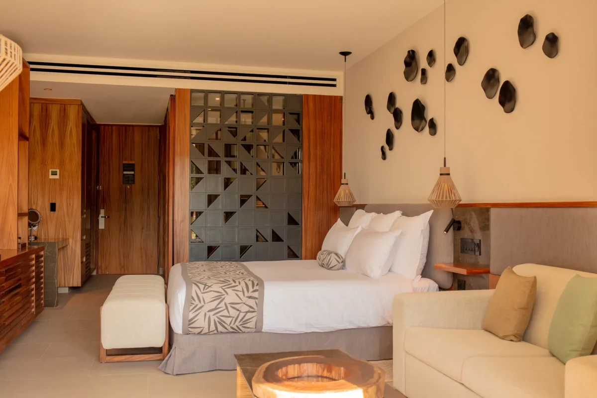 Preferred Club Junior Suite Panoramic View with king bed and modern décor at Secrets Bahia Mita Surf & Spa Resort.