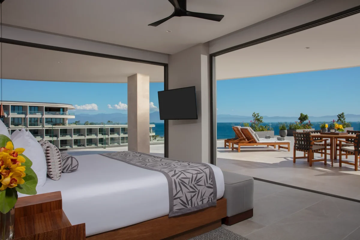 Preferred Club Presidential Suite Ocean View master bedroom with king bed and terrace access at Secrets Bahia Mita Surf & Spa Resort.