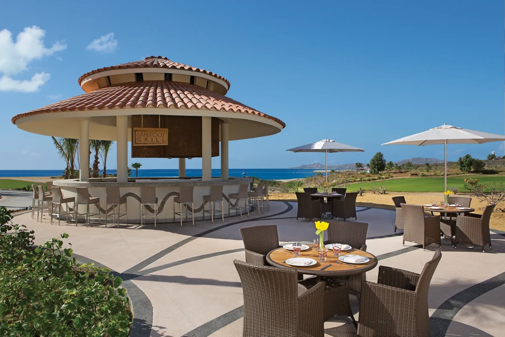 Barefoot Grill at Secrets Puerto Los Cabos featuring open-air dining, grilled specialties, and a relaxed poolside setting.