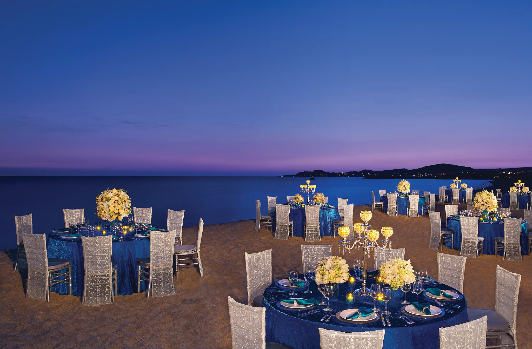 Elegant beach gala dinner reception setup at Secrets Puerto Los Cabos