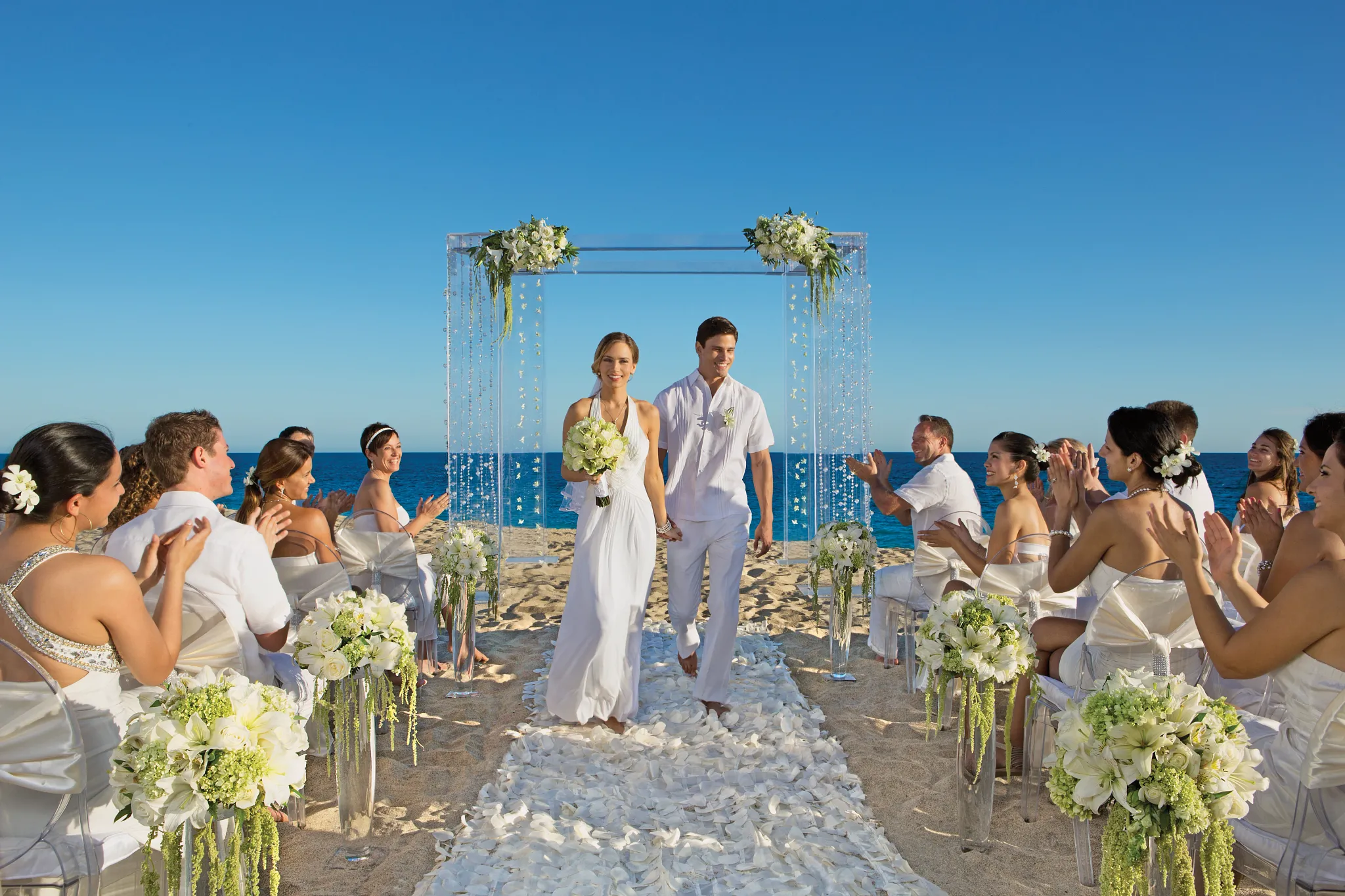 Beach wedding venue at Secrets Puerto Los Cabos with oceanfront ceremony setup on the Sea of Cortez