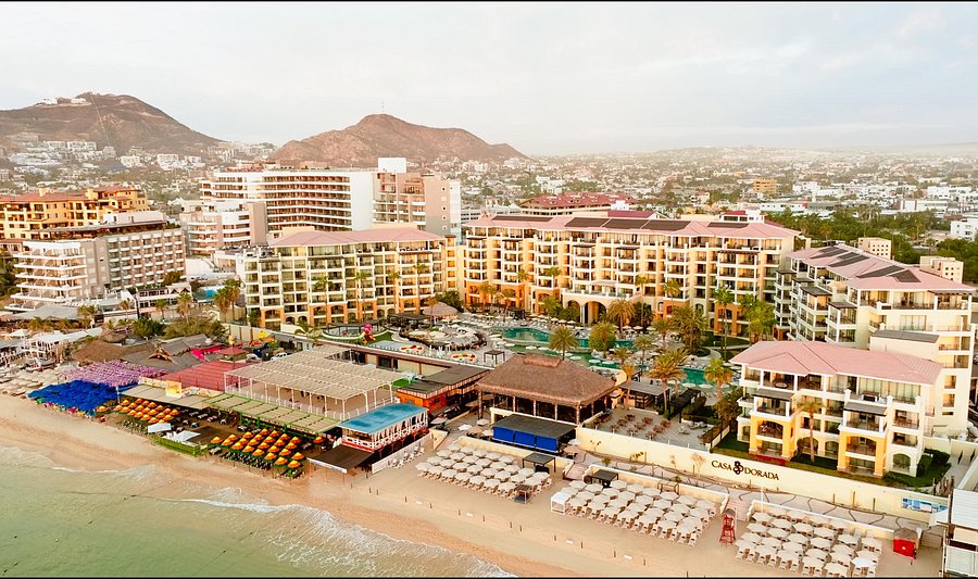 Casa Dorada Los Cabos beachfront resort on Medano Beach with swimmable waters and marina views.