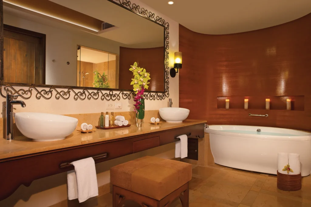 Master Suite Swim Out bathroom with dual sinks and soaking tub at Secrets Puerto Los Cabos Golf & Spa Resort.