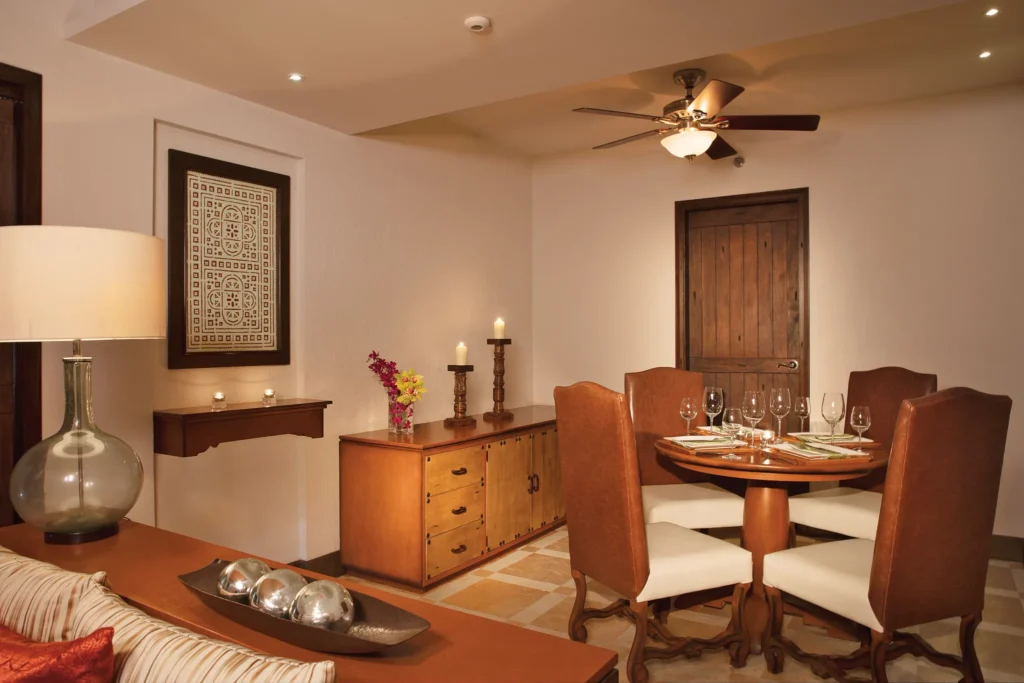 Master Suite Swim Out dining area with round table and seating at Secrets Puerto Los Cabos Golf & Spa Resort.