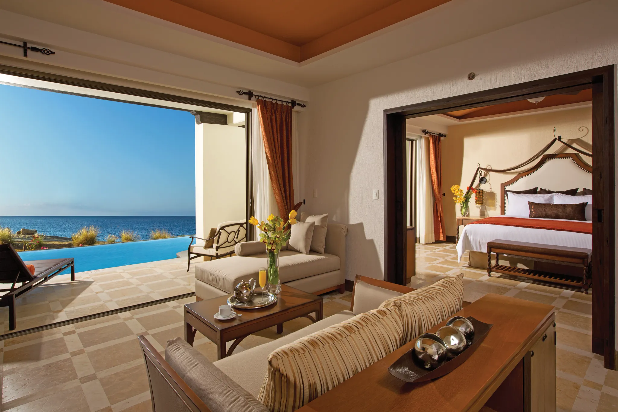 Master Suite Swim Out Ocean Front living area with terrace and private pool access at Secrets Puerto Los Cabos Golf & Spa Resort.