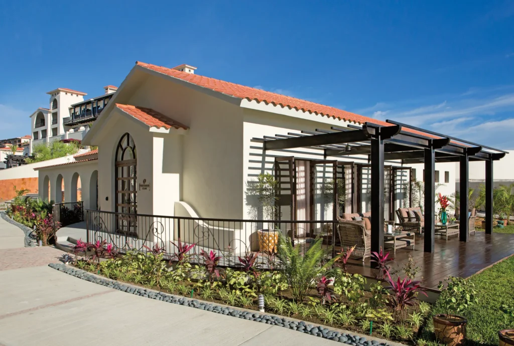 Preferred Club building with terrace and modern Mexican architecture at Secrets Puerto Los Cabos.