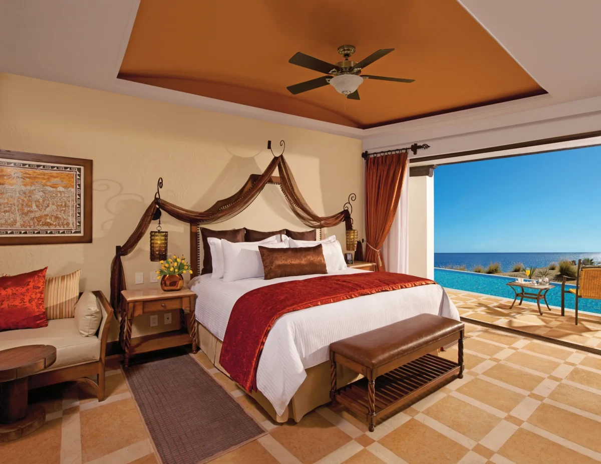 Preferred Club Junior Suite Swim Out Ocean Front king bedroom with terrace and ocean view at Secrets Puerto Los Cabos.