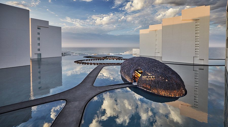 Viceroy Los Cabos luxury beachfront resort with modern architecture, reflective pools, and upscale design in San Jose del Cabo, Mexico.