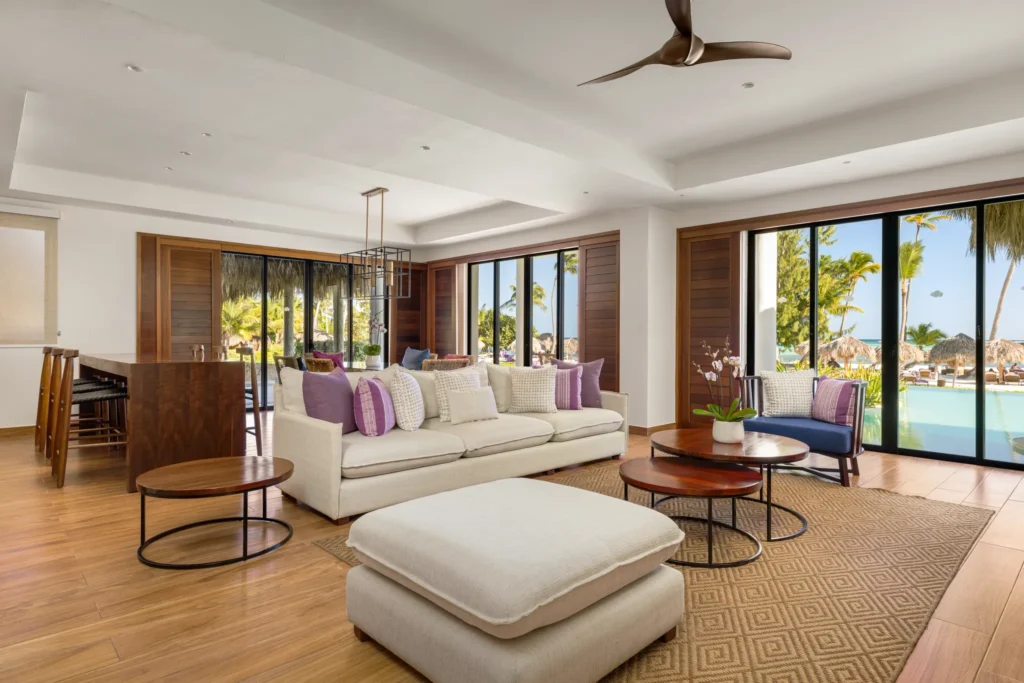 Preferred Club Bungalow Presidential Suite living room with oceanfront views and spacious seating area at Secrets Cap Cana.