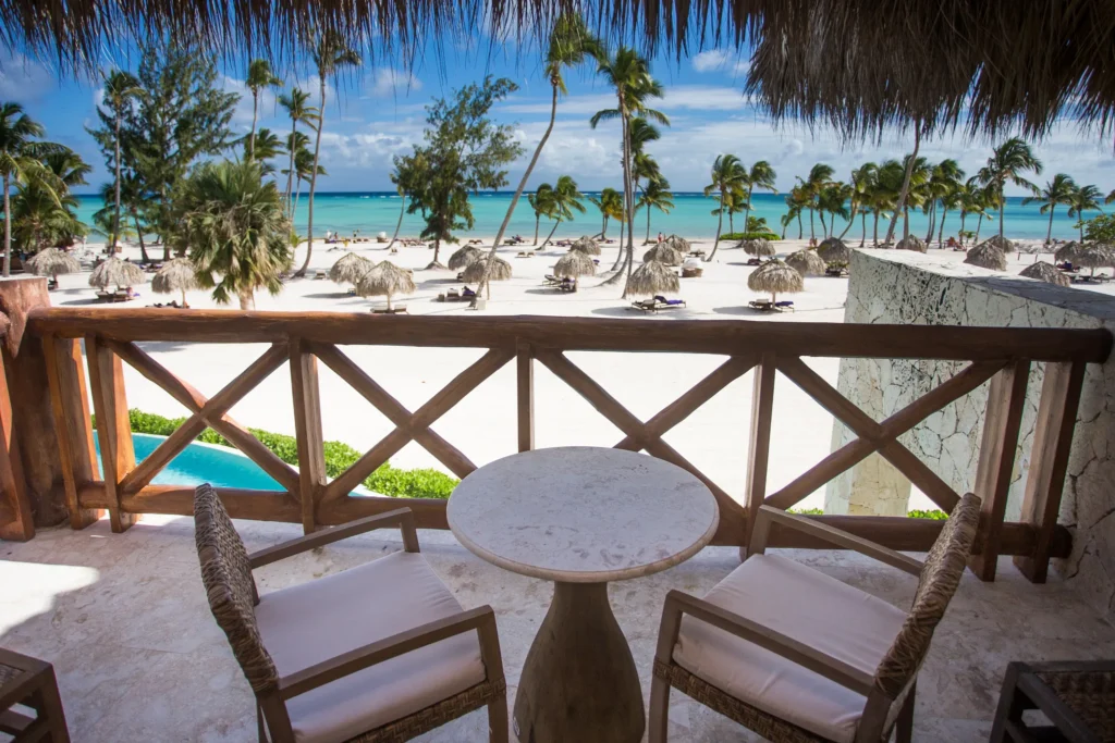 Private furnished balcony overlooking the beach and Caribbean Sea from the Preferred Club Bungalow Suite Ocean Front at Secrets Cap Cana Resort & Spa.