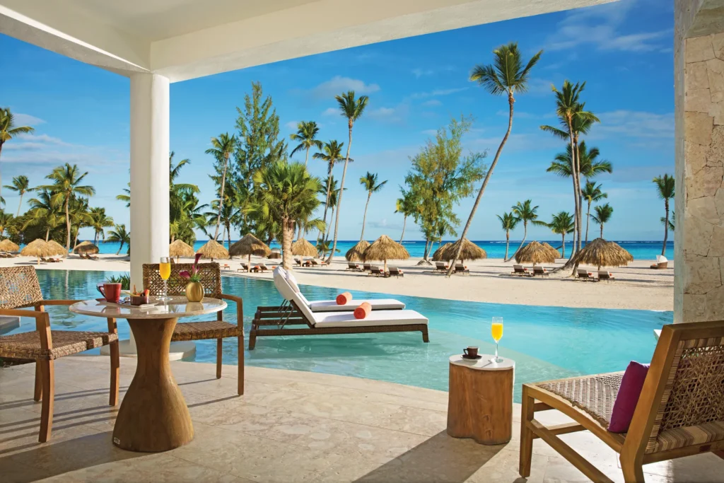 Furnished swim-out terrace overlooking the beach and Caribbean Sea from the Preferred Club Bungalow Suite Swim Out Ocean Front.