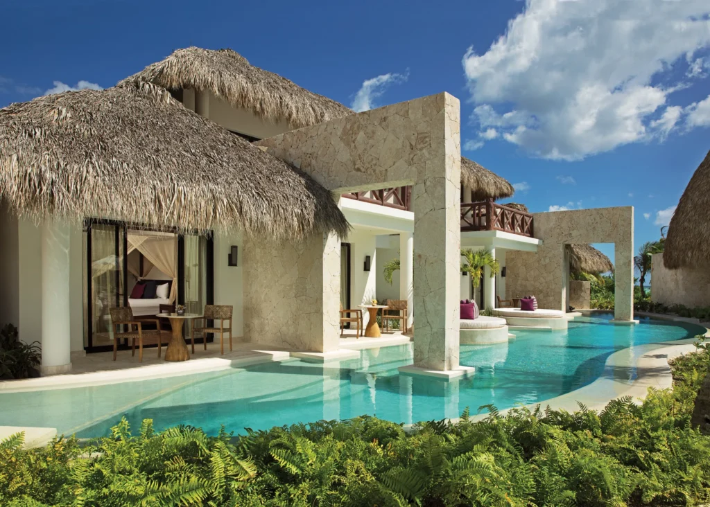 Preferred Club Bungalow Suite Swim Out Pool View exterior with direct swim-out pool access, private terrace, and Caribbean-style thatched-roof architecture.