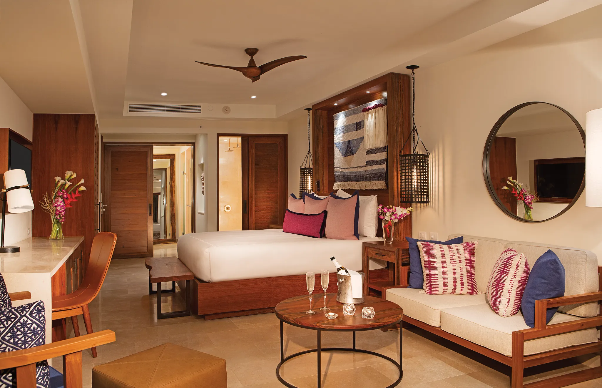 Preferred Club Junior Suite Swim Out Pool View with king-size bed, sitting area, and elegant Caribbean-inspired décor at Secrets Cap Cana Resort & Spa.