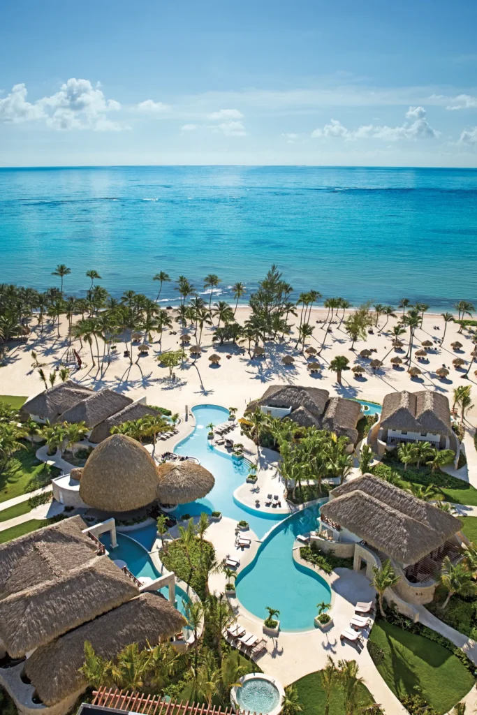 Aerial view of the Preferred Club bungalows and private pool area at Secrets Cap Cana Resort & Spa overlooking the Caribbean Sea.