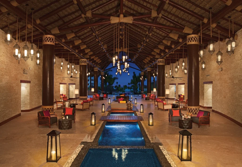Grand open-air lobby with elegant Caribbean-inspired architecture at Secrets Cap Cana Resort & Spa.