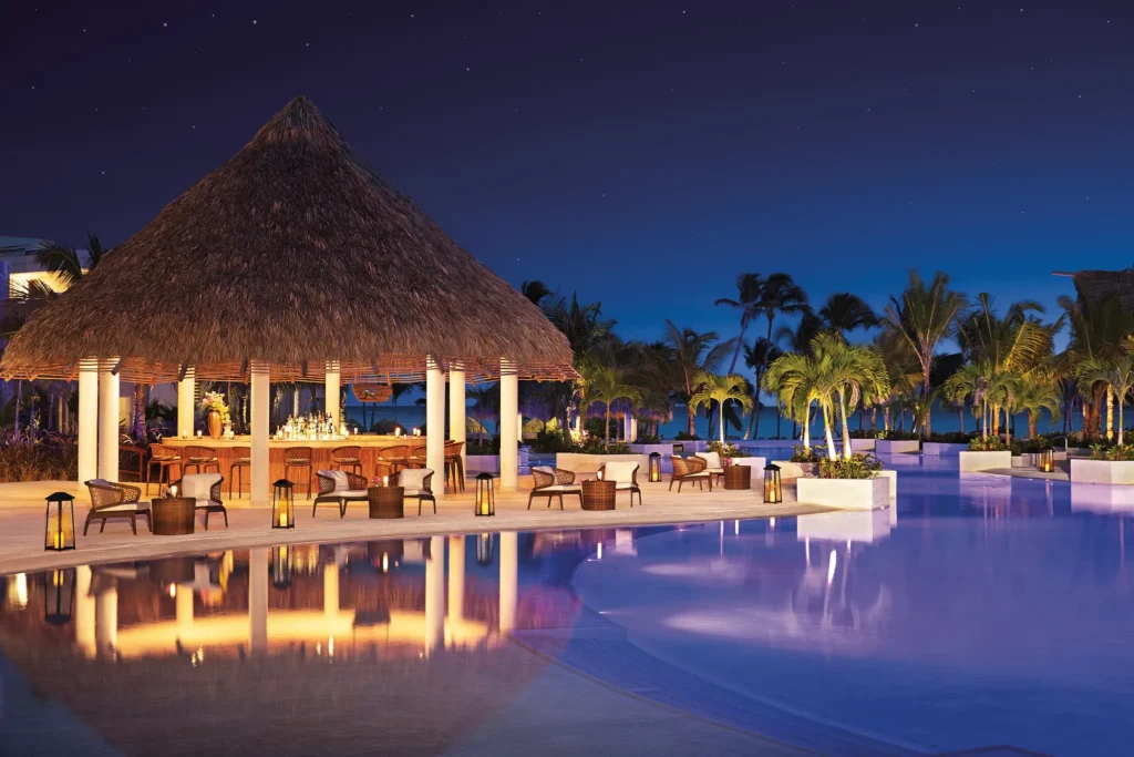 Sugar Reef pool bar at Secrets Cap Cana Resort & Spa featuring tropical cocktails, swim-up service, and a relaxed poolside atmosphere.