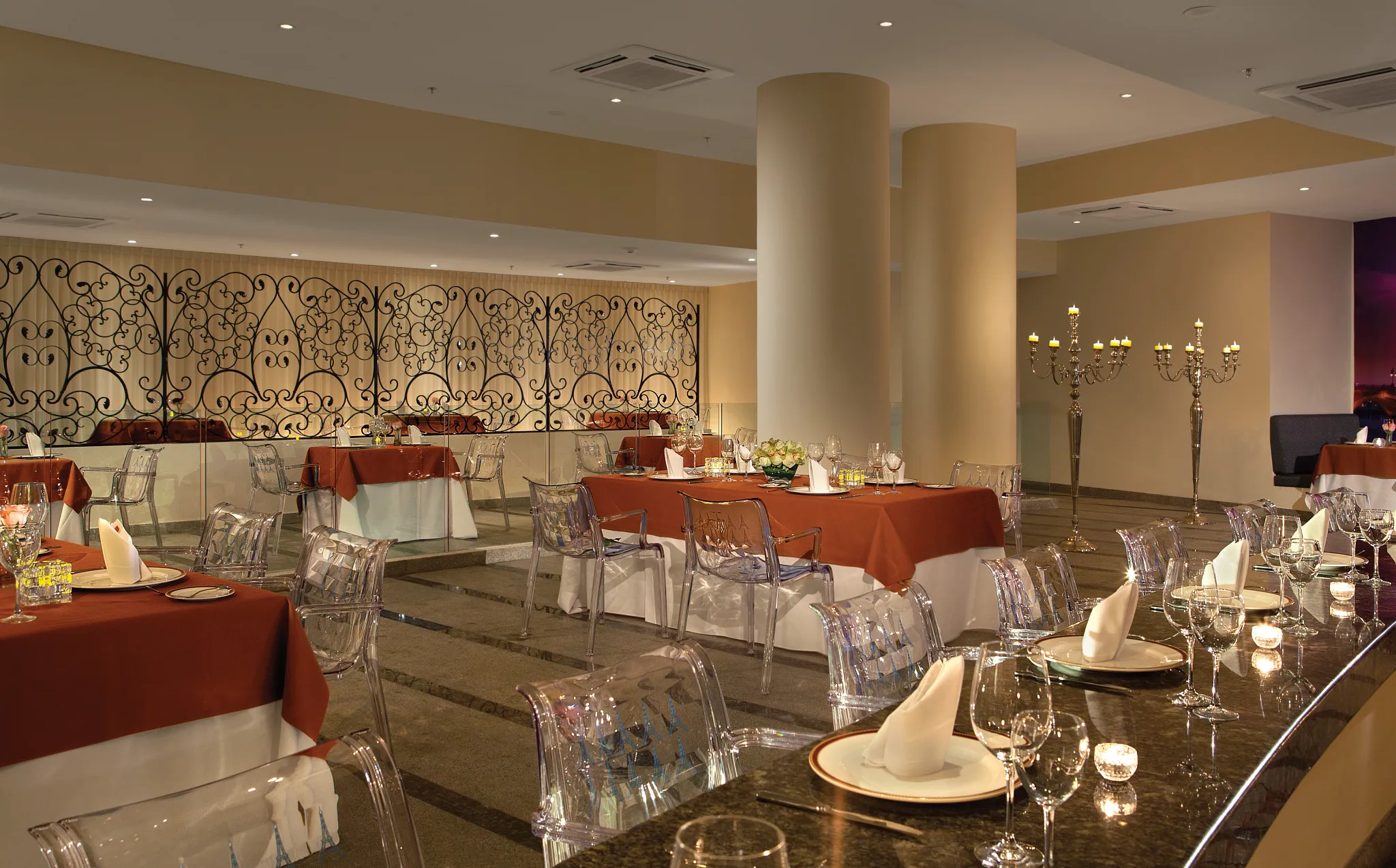 Bordeaux French Restaurant at Secrets Huatulco Resort & Spa featuring elegant table settings, candlelit ambiance, and refined fine-dining décor.