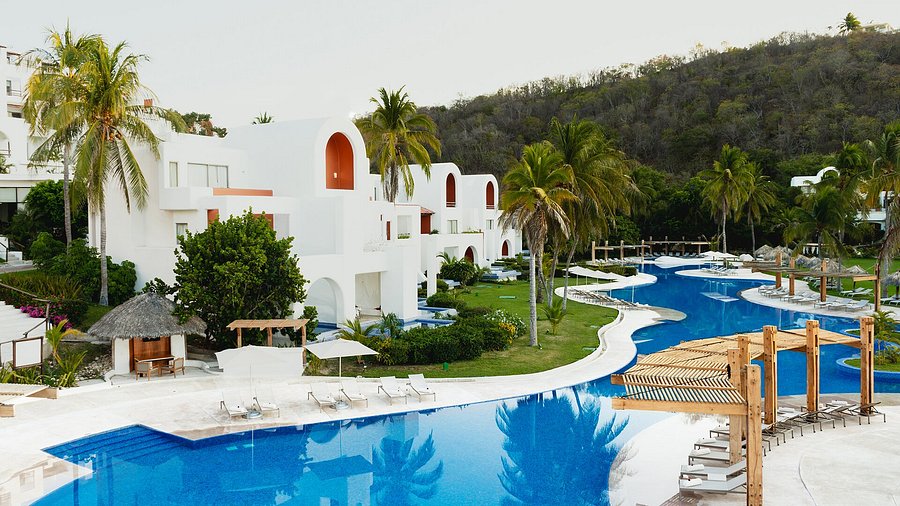 Camino Real Zaashila Huatulco luxury resort with traditional Mexican architecture and beachfront setting on Tangolunda Bay.