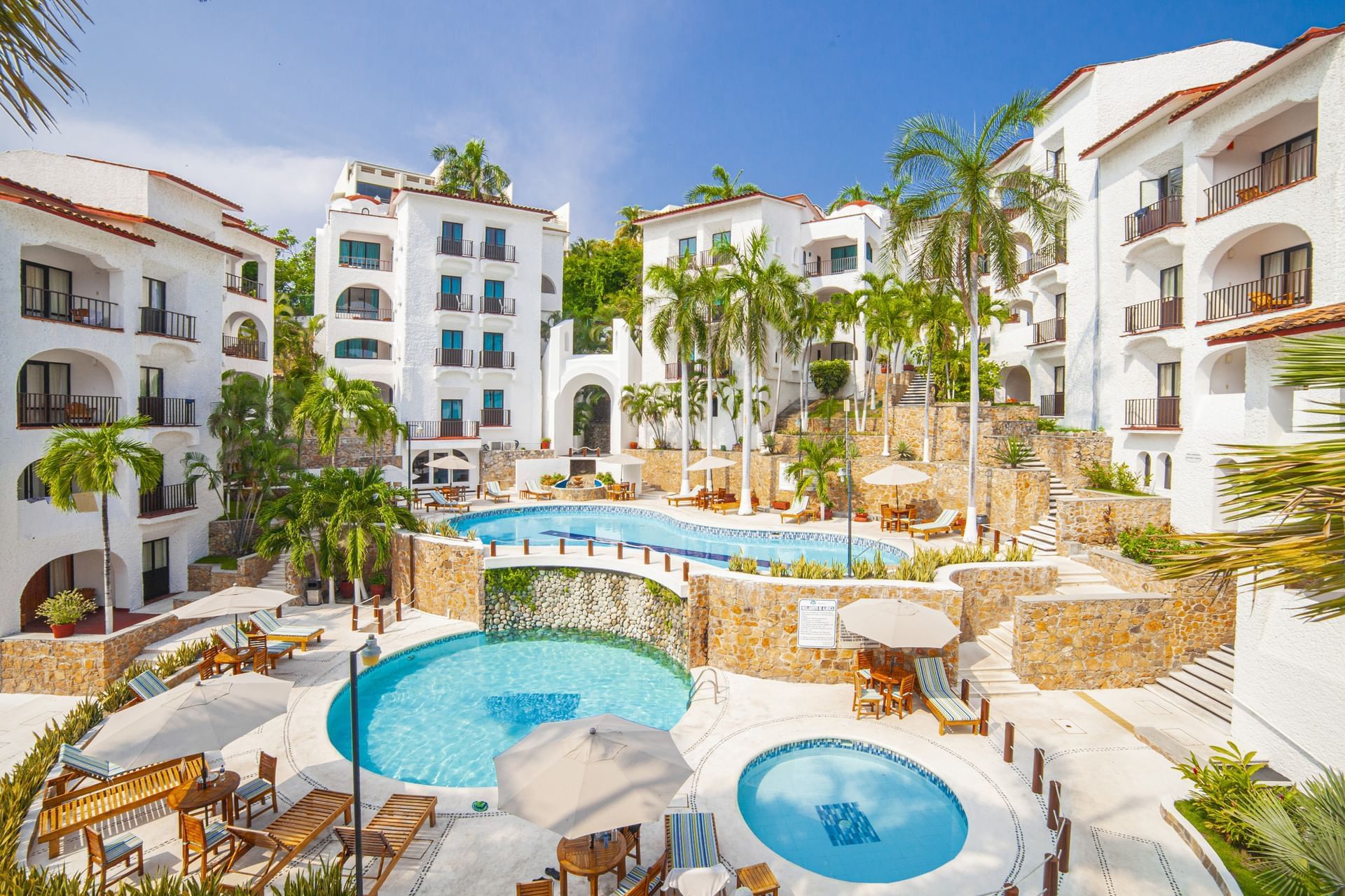Hotel Marina Resort & Beach Club Huatulco waterfront property with marina views, pools, and casual beach club atmosphere.