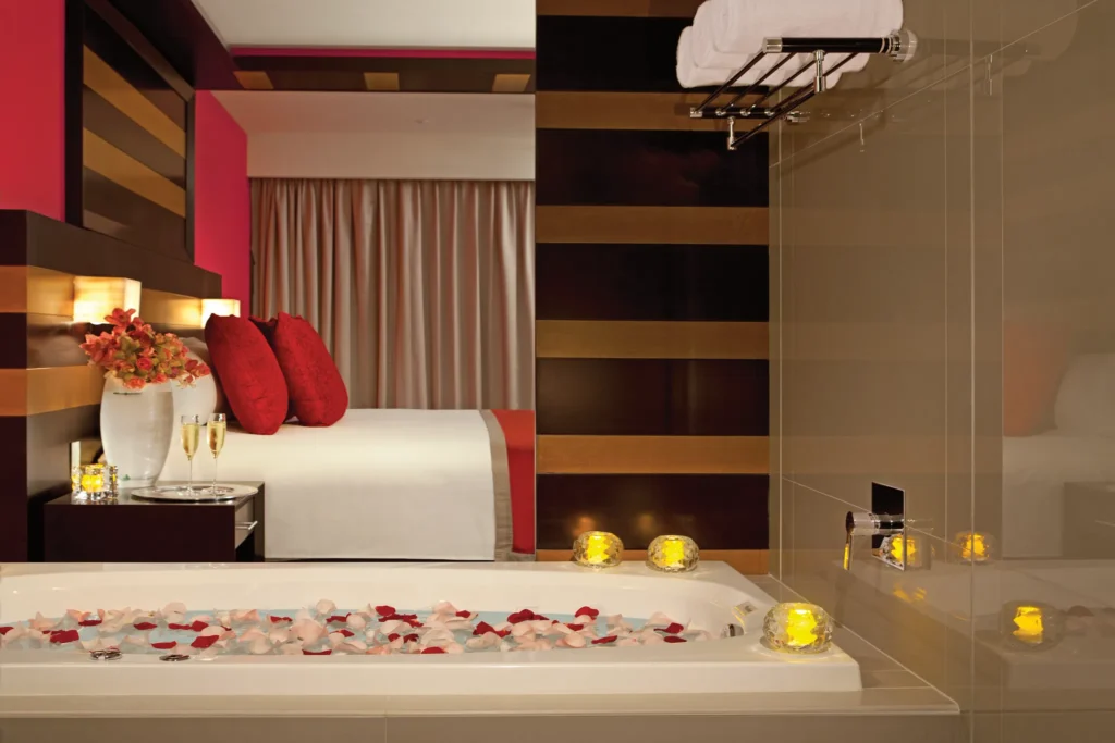 Preferred Club Junior Suite Ocean Front bathroom with rain shower and soaking tub at Secrets Huatulco.