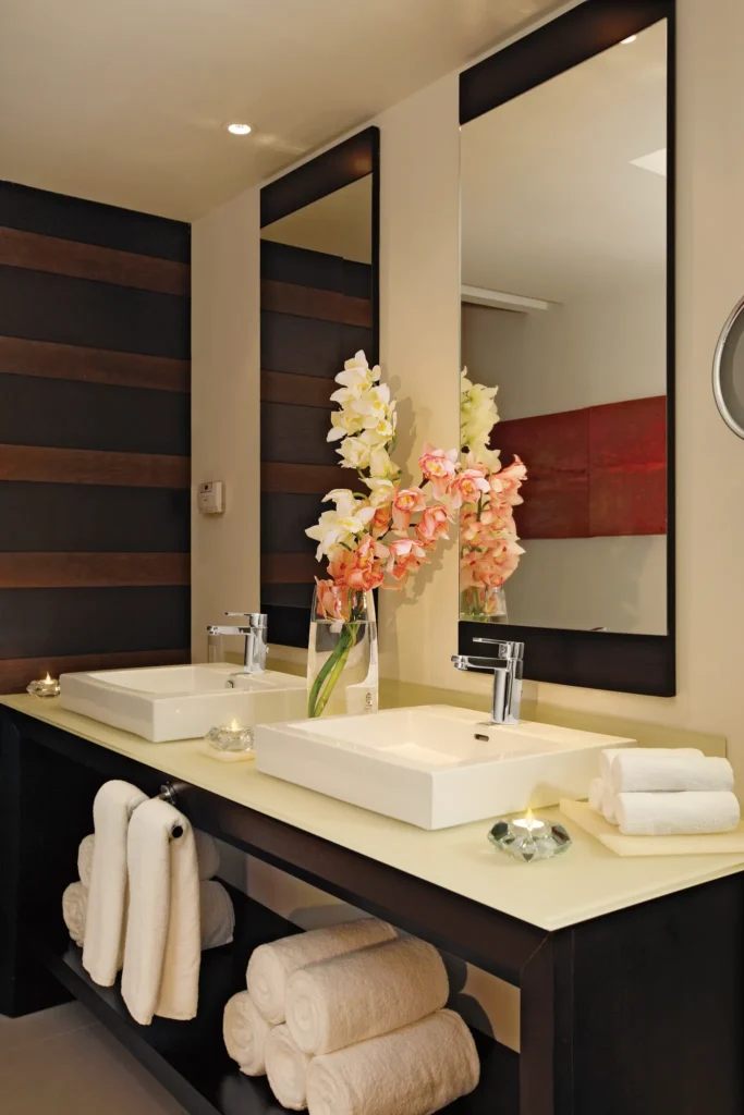 Preferred Club Junior Suite Ocean Front bathroom with double sink vanity at Secrets Huatulco Resort & Spa.