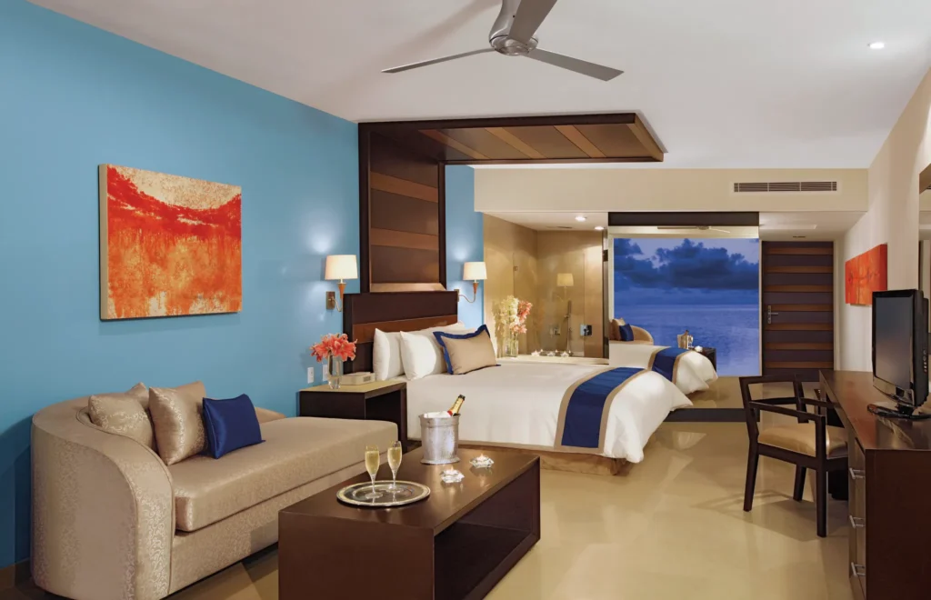 Preferred Club Junior Suite Ocean Front with king bed and sitting area at Secrets Huatulco Resort & Spa.