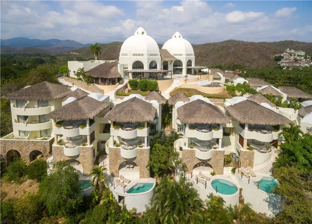 Quinta Real Huatulco luxury boutique hotel with hacienda-style architecture overlooking Tangolunda Bay in Huatulco, Mexico.