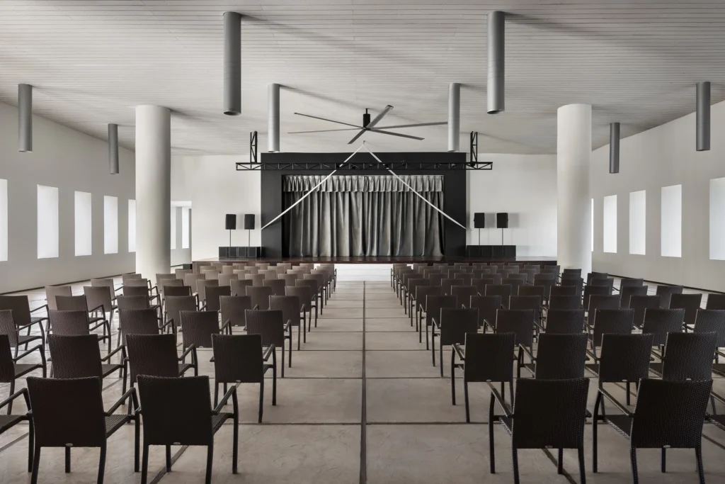 Indoor theater with seating and stage at Secrets Huatulco Resort & Spa for nightly entertainment and events.