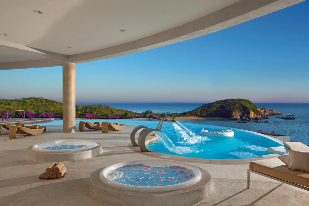 Hydrotherapy spa circuit pools with ocean views at Secrets Huatulco Resort & Spa in Mexico.