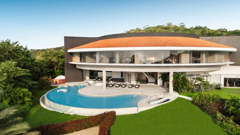 Exterior spa pool at Secrets Huatulco Resort & Spa surrounded by lush tropical landscaping, offering a serene adults-only relaxation experience.