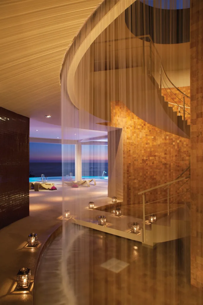 Elegant spa lobby with cascading water feature at Secrets Huatulco Resort & Spa, creating a calming and luxurious welcome space.