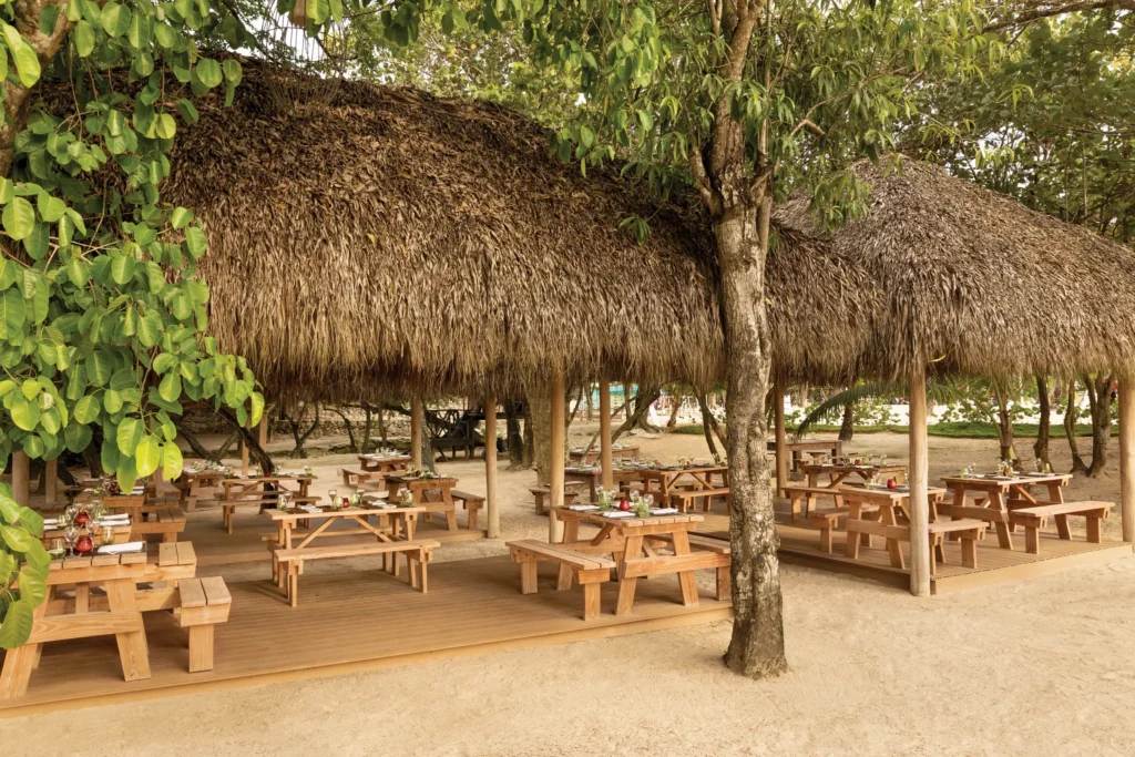 Chinola bar at Secrets La Romana Resort & Spa featuring tropical cocktails, stylish lounge seating, and vibrant Caribbean ambiance.