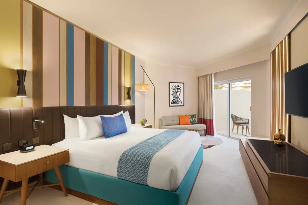 Deluxe Garden View Accessible king room with private terrace at Secrets La Romana Resort & Spa.