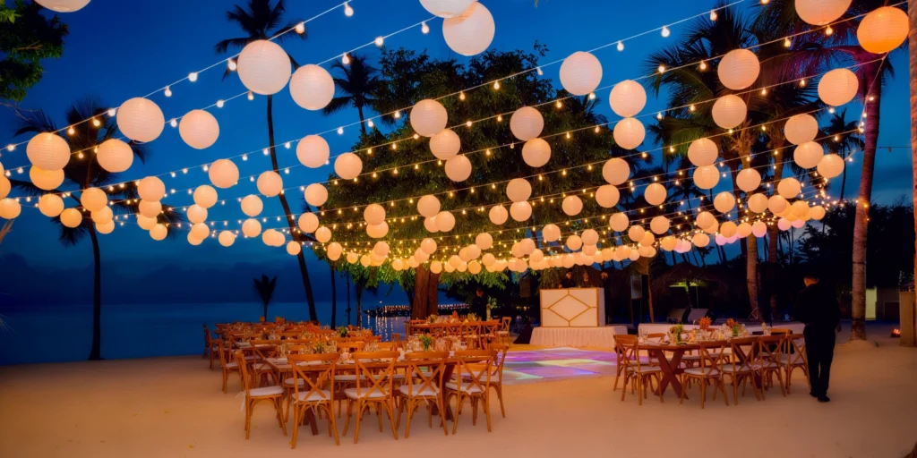 La Vela Beach adults-only wedding reception setup at night at Secrets La Romana Resort & Spa