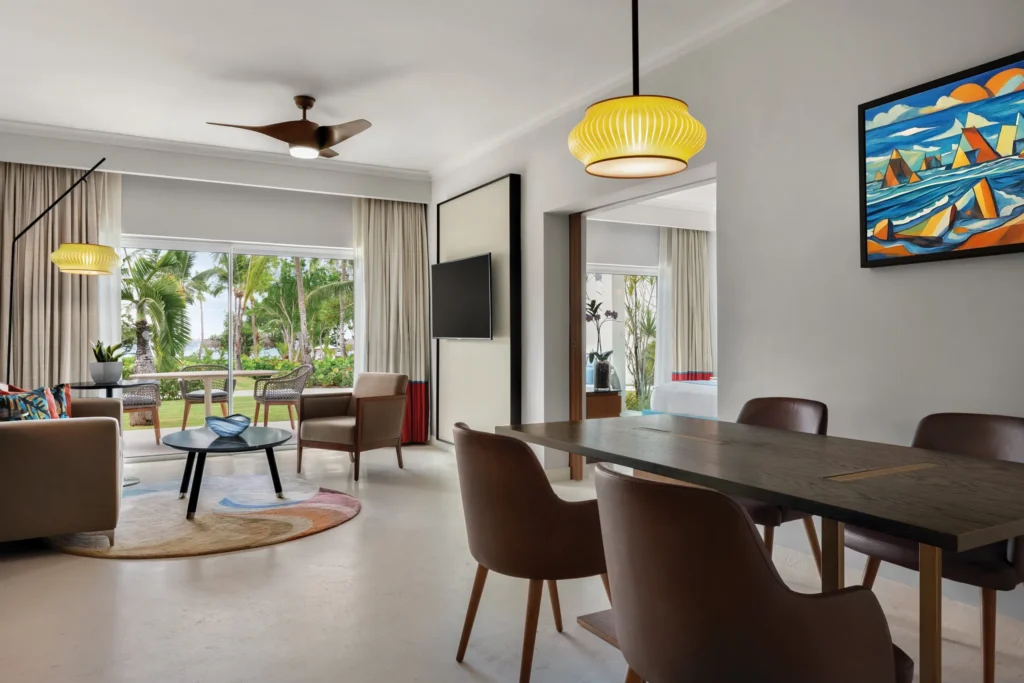 Preferred Club Garden View Suite dining and living area at Secrets La Romana Resort & Spa.