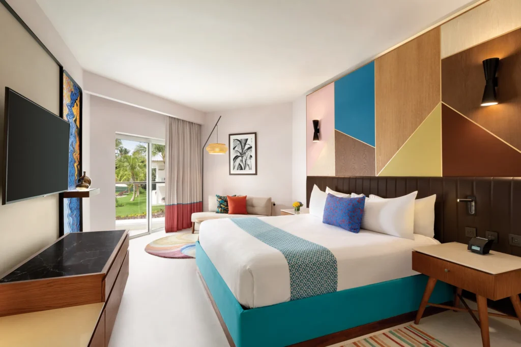 Preferred Club Partial Ocean View king room with furnished balcony at Secrets La Romana Resort & Spa.