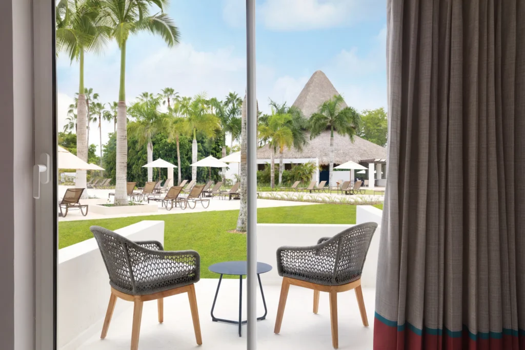 Preferred Club Pool View terrace overlooking the resort pool at Secrets La Romana Resort & Spa.