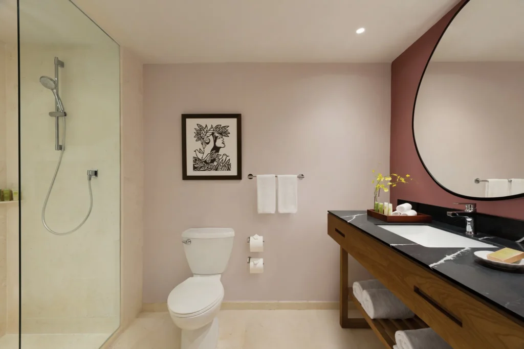 Premium Garden View bathroom with walk-in shower and modern vanity at Secrets La Romana Resort & Spa.