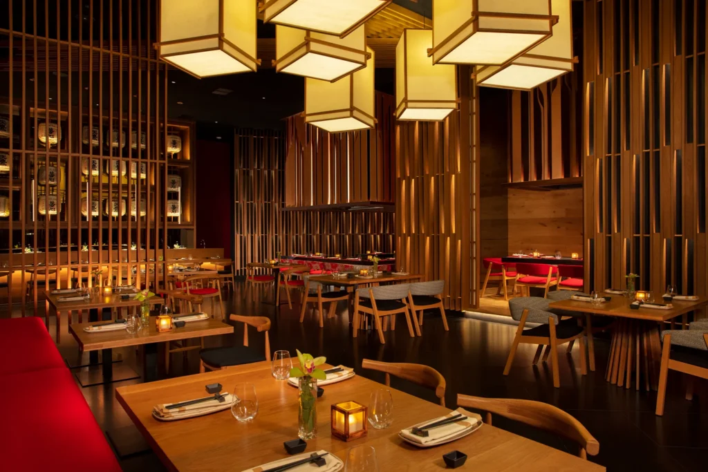 Elegant dining room at Himitsu Pan-Asian restaurant with sushi bar and teppanyaki tables at Secrets Maroma Beach Riviera Cancun.