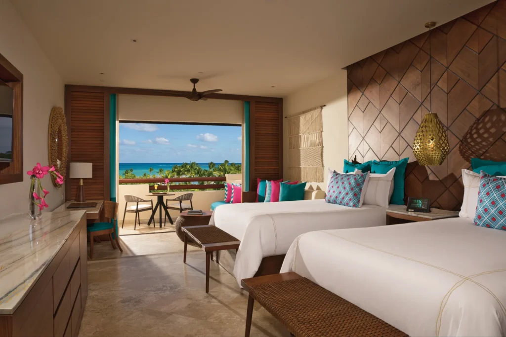Junior Suite Ocean View with two double beds and private balcony at Secrets Maroma Beach Riviera Cancun.