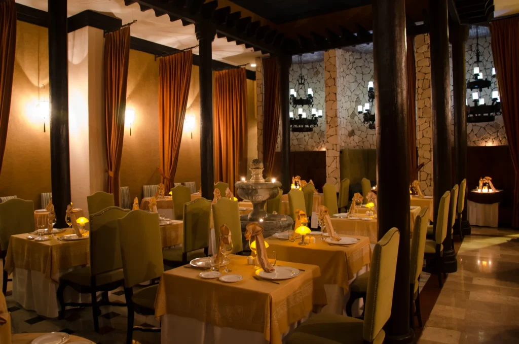 Romantic candlelit dining room at Portofino Italian restaurant at Secrets Maroma Beach Riviera Cancun.