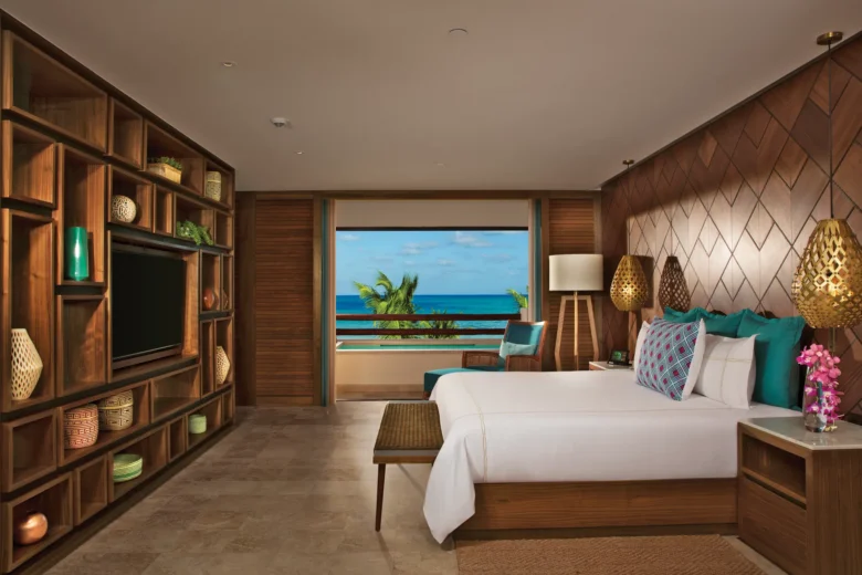 Preferred Club Honeymoon Suite king bedroom with oceanfront view at Secrets Maroma Beach Riviera Cancun.