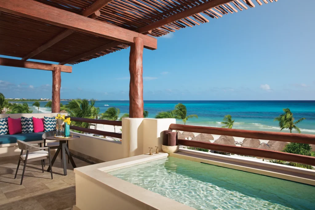 Preferred Club Honeymoon Suite oceanfront terrace with exterior soaking tub at Secrets Maroma Beach Riviera Cancun.