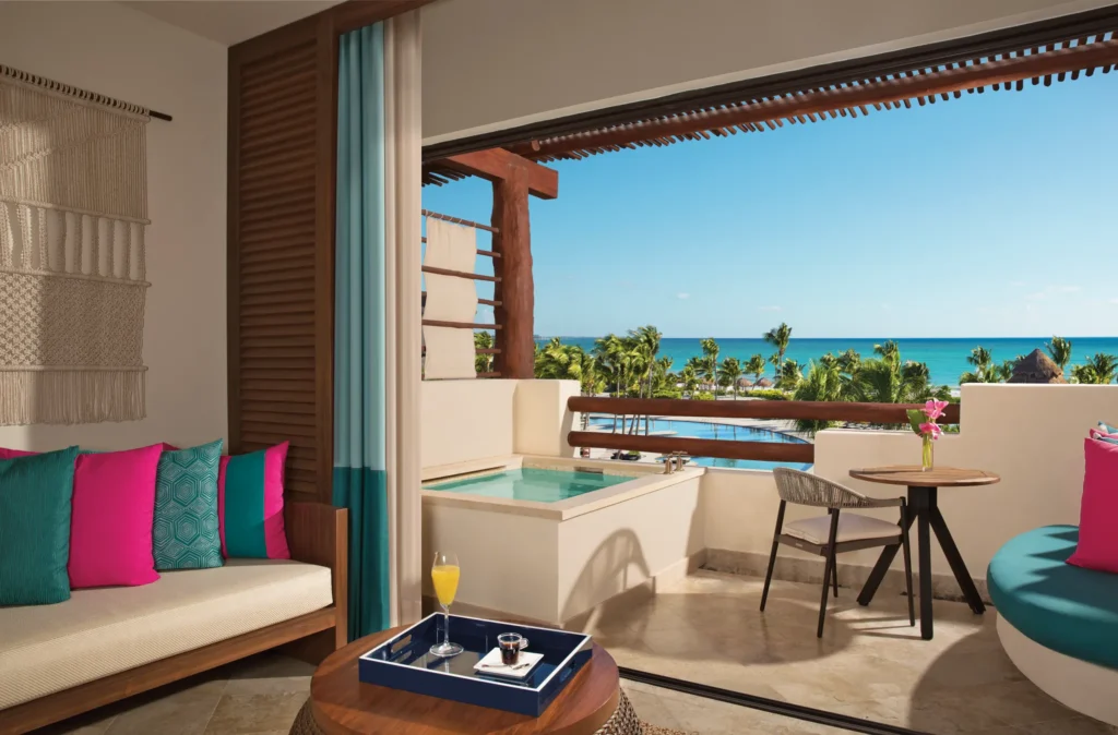 Preferred Club Junior Suite Ocean View terrace with soaking tub and Caribbean Sea views at Secrets Maroma Beach Riviera Cancun.