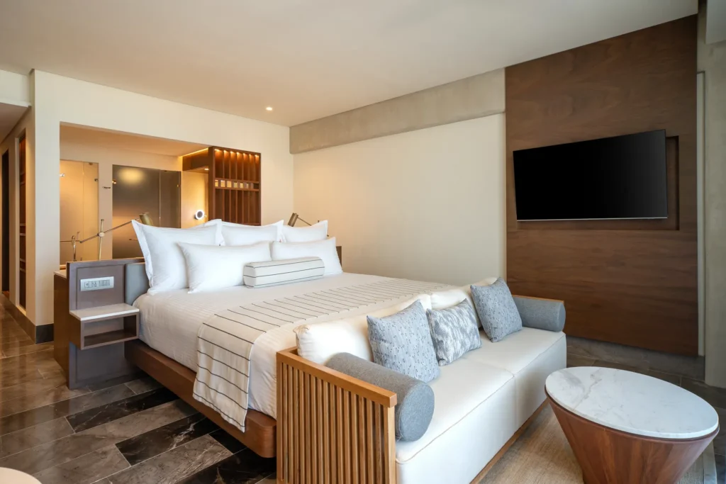 Modern king bedroom inside the Penthouse Presidential Plus One Junior Suite at Secrets Mirabel Cancun Resort & Spa.