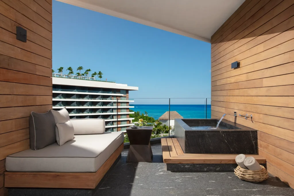 Preferred Club Junior Suite Ocean View terrace with soaking tub overlooking the Caribbean at Secrets Moxché Playa del Carmen.