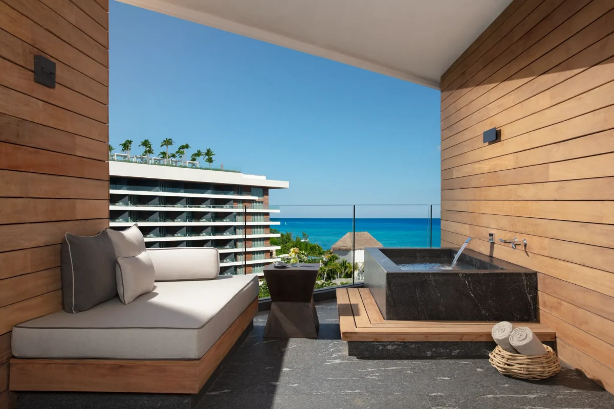 Preferred Club Junior Suite Ocean View terrace with soaking tub overlooking the Caribbean at Secrets Moxché Playa del Carmen.