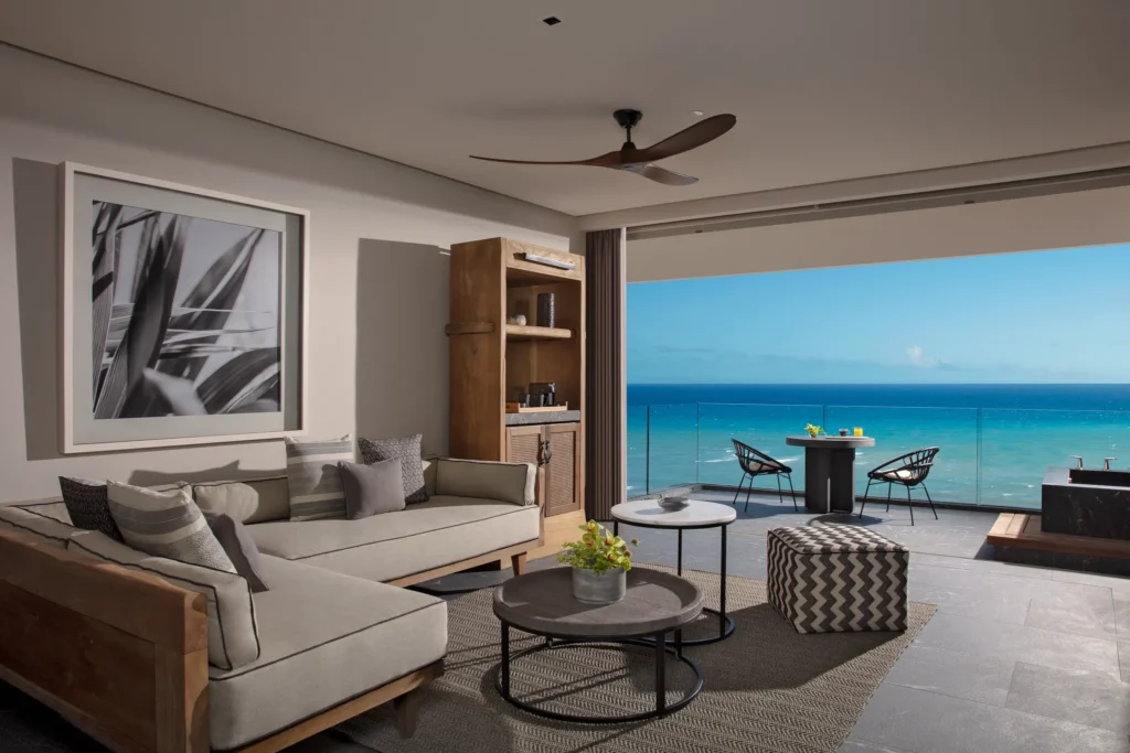 Preferred Club Master Suite Oceanfront living room with ocean-view terrace at Secrets Moxché Playa del Carmen.